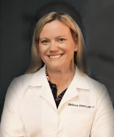 Melissa Welch, APRN, in a white clinic coat